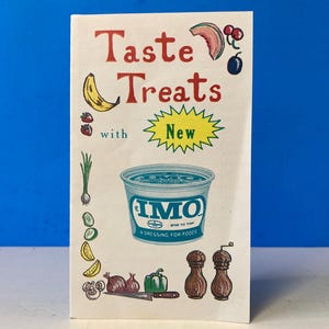 May include: A vintage advertisement for IMO, a new dressing for foods. The ad features a blue and white container of IMO, surrounded by various fruits and vegetables, including a banana, strawberries, watermelon, and onions. The text on the ad reads "Taste Treats with New IMO A Dressing For Foods".