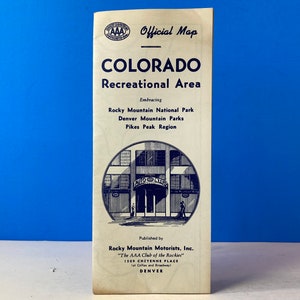 May include: A vintage AAA Official Map of Colorado Recreational Area, featuring a black and white illustration of a building with the text "Auto Club" above the entrance. The map embraces Rocky Mountain National Park, Denver Mountain Parks, and Pikes Peak Region. It was published by Rocky Mountain Motorists, Inc., "The AAA Club of the Rockies", 1509 Cheyenne Place, Denver.