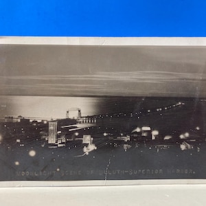 Scena al chiaro di luna del porto superiore di Duluth RPPC cartolina 1934