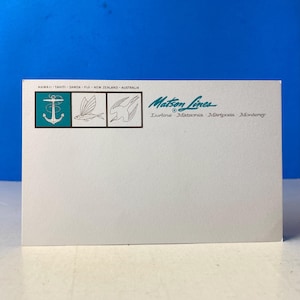 May include: A vintage Matson Lines postcard featuring teal and black illustrations of an anchor, a fish, and a bird. The postcard includes text indicating destinations such as Hawaii, Tahiti, and Australia, along with the names of ships.
