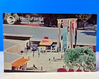 May include: A vintage postcard featuring a model of the HemisFair '68 Texas World's Fair. The postcard shows a colorful model of the fairgrounds with buildings, flags, and people. The text "HemisFair '68" and "Texas World's Fair" is printed on the postcard.