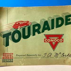 May include: Vintage spiral-bound booklet titled "TOURAIDE" with a red car graphic and the Conoco logo. The cover is light green with dark green and red text. The booklet is prepared for J. A. McCortle.