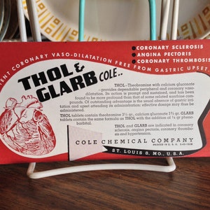 May include: Red and white vintage medicine advertisement for Thol & Glarb Cole. The ad features a red heart illustration and text that reads "Potent Coronary Vaso-Dilatation Free From Gastric Upset" and "Thol & Glarb Cole."