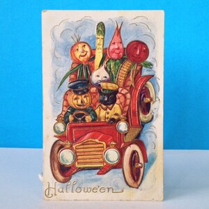 Halloween Gato negro y verduras en un coche postal en relieve