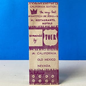 May include: A vintage guide to the best restaurants and hotels in California, Old Mexico, and Nevada. The guide features a purple crown and the text "the very best" and "TOUR" on a tan background.