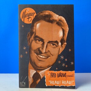 May include: A black and white programme for a Fred Waring performance. The programme features a photo of Fred Waring and the text "Fred Waring presents "Hear! Hear!"  The programme is decorated with stars.