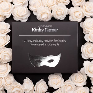 Couples relationship game "Kinky Game"; a close up, surrounded in roses