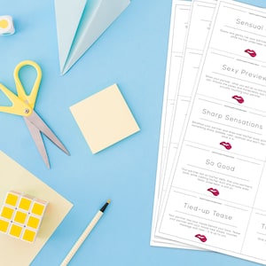 May include: A set of white cards with black text and red lips printed on them. The cards have phrases like "Sensual Job", "Sexy Tease", "Sexy Preview", "Sexy Whisperer", "Sharp Sensations", "Slow Dance", "So Good", "Thigh Massage", "Tied-up Tease", and "Tight Sensations".
