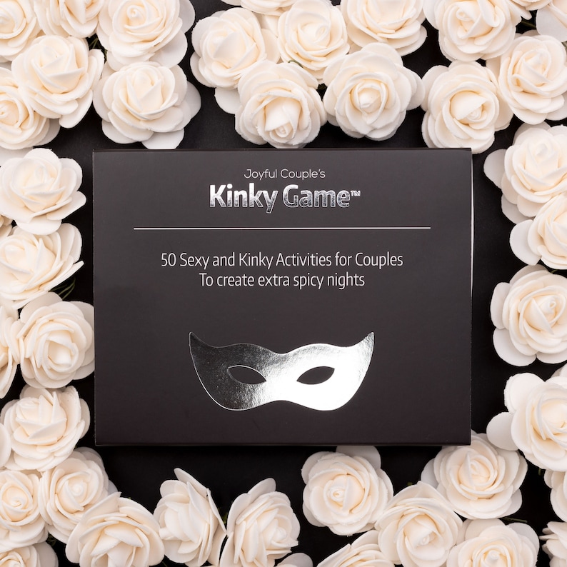 Couples relationship game "Kinky Game"; a close up, surrounded in roses