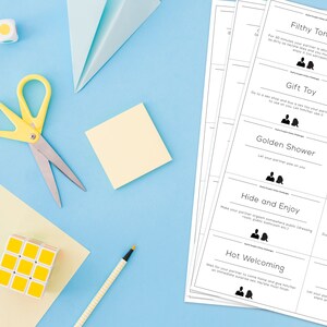 May include: A set of white cards with black text and illustrations. The cards feature phrases like "Filthy Tongue", "Gift Toy", "Golden Shower", "Hide and Enjoy", "Hot Welcoming", "Finish ASAP", "Giver", "Good Enough?", "Hot Chef", and "Human Doll".