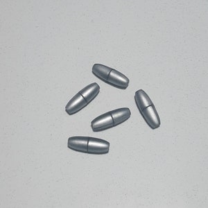 May include: Five silver metal cord end stoppers. The stoppers are oval shaped and have a smooth, shiny finish.