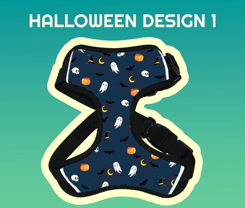 May include: A black dog harness with a Halloween-themed design. The harness features a blue background with orange pumpkins, white ghosts, black bats, and crescent moons.