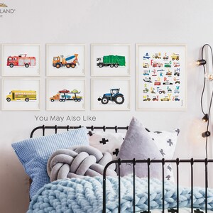 May include: A set of six framed prints featuring colorful illustrations of different vehicles, including a fire truck, a cement mixer, a garbage truck, a school bus, a car carrier, and a tractor. The prints are arranged in a grid pattern on a white wall. The text "You May Also Like" is visible below the prints.