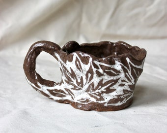 White Floral Illustrated Mug on Brown Clay