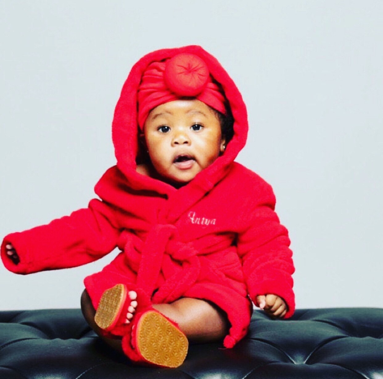 Baby in dressing gown 2025