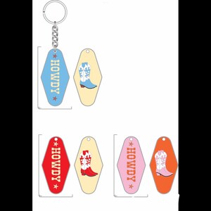 May include: Set of five keychains featuring a retro motel key design. Each keychain has a different colour background and a boot design with a white star and the word "HOWDY" in yellow text.