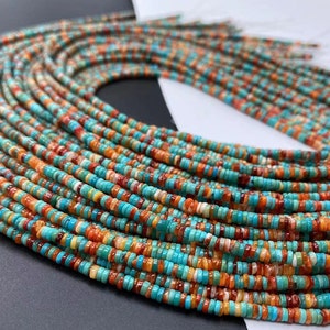 May include: A strand of turquoise, red, orange, and white beads. The beads are small and round, and they are strung together on a thin wire. The beads are arranged in a random pattern, and they create a colourful and eye-catching design.