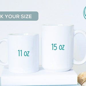 May include: Two white ceramic mugs, one 11 oz and one 15 oz, are shown side-by-side on a white surface. The mugs are blank, ready for personalization.