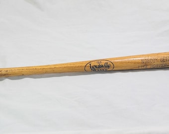 Anuncio antiguo de bate Louisville Slugger: Nadie se ensucia como una aspiradora en miniatura