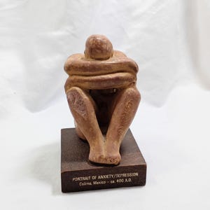 Figura vintage Schering Etrafon RX con retrato de ansiedad y depresión