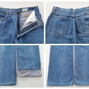 May include: Four-panel image of light blue denim Wrangler jeans. The jeans are shown from multiple angles, including front, back, and close-ups of the details. The jeans have a zipper fly, pockets, and the Wrangler logo.