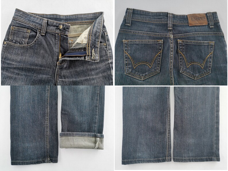 K&ouml;nnte beinhalten: Dunkelblaue Jeans aus Denim mit Rei&szlig;verschluss und Knopf, zwei Ges&auml;&szlig;taschen mit goldfarbenen N&auml;hten und einem braunen Lederaufn&auml;her am Bund mit der Aufschrift Edwin. Die Beinhosen sind gerade geschnitten, ein Bein ist umgeschlagen.