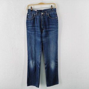 May include: A pair of blue denim jeans hanging on a wooden hanger. The jeans have a classic five-pocket design, a button and zipper closure, and a straight leg. The denim has a faded appearance.