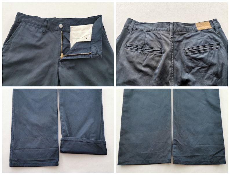 May include: Navy blue pants with a button and zipper closure. The pants have front and back pockets, and the bottom of the pants are cuffed. The pants are made of a durable fabric.