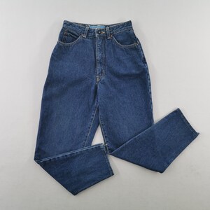 May include: Dark blue denim jeans with a high waist and straight leg. The jeans have classic five-pocket styling, a button and zipper closure, and belt loops. The denim is a medium weight, suitable for casual wear.