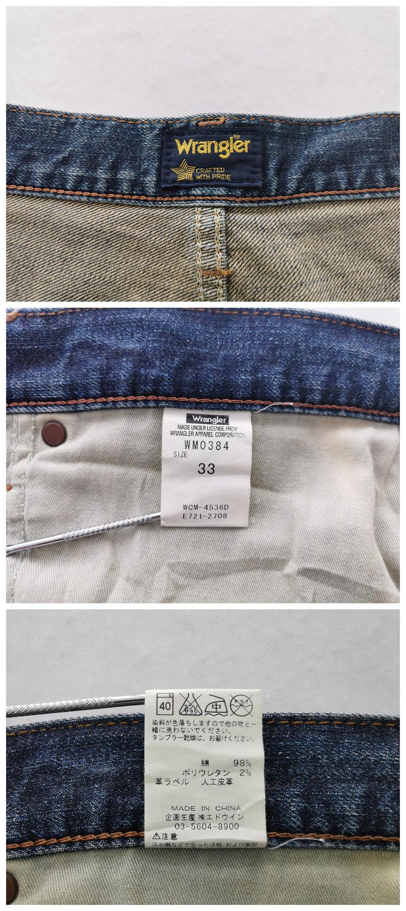 May include: Close-up of Wrangler denim jeans. The image shows the inside of the jeans with tags indicating size 33, model number WM0384, and care instructions. The Wrangler logo is visible.
