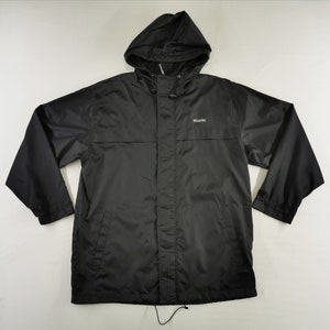 May include: A black hooded rain jacket with a drawstring hood and a small logo on the chest. The jacket has long sleeves and a front zipper closure. The material appears to be a lightweight, water-resistant fabric, suitable for wet weather.