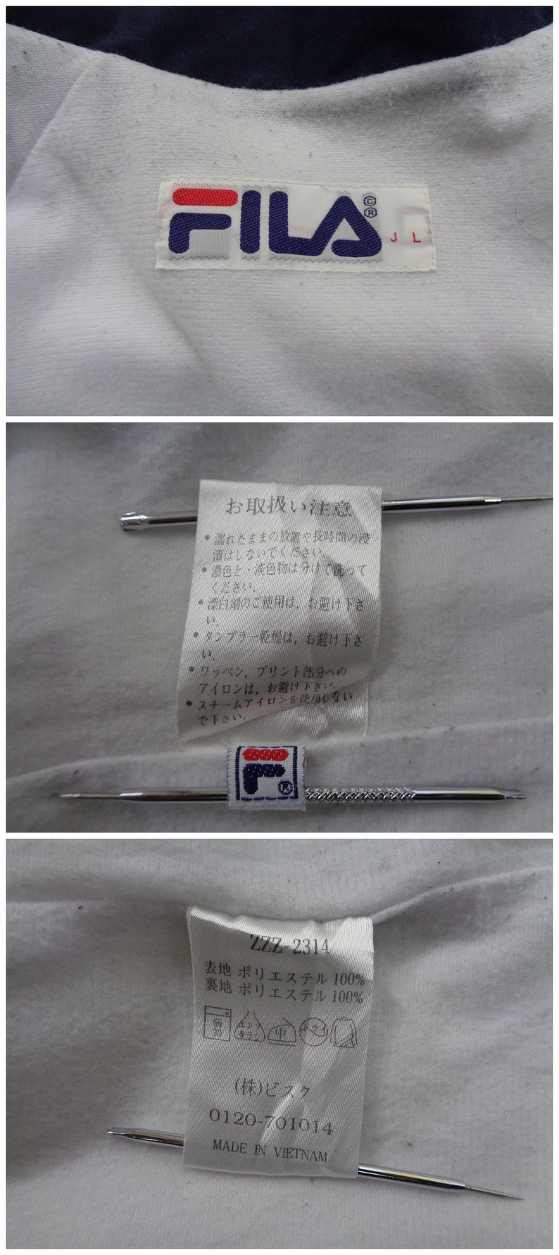 May include: Close-up of a white garment with a navy blue collar. The FILA logo is visible on a tag. Additional tags with Japanese text and care instructions are also present.