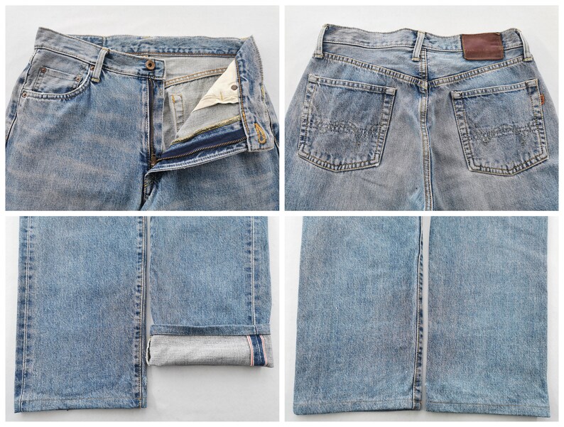 May include: Light blue denim jeans with a classic five-pocket design. The jeans feature a button and zipper closure, belt loops, and a leather patch on the back. The bottom of the jeans are cuffed, revealing a contrasting fabric.
