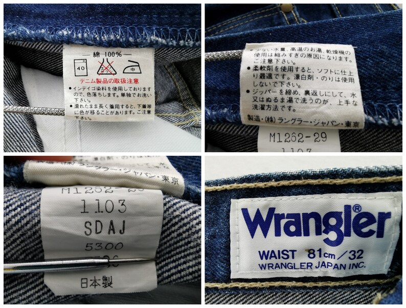 May include: Close-up of blue denim jeans with multiple tags. One tag reads "Wrangler" with "WAIST 81cm/32". Other tags include washing instructions and Japanese text. The jeans are made of 100% cotton.