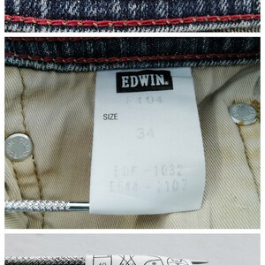 May include: Detail of denim jeans with the "EDWIN INTERNATIONAL BASIC" label. The jeans feature red stitching and a size 34 label. Additional tags provide care instructions and product details.