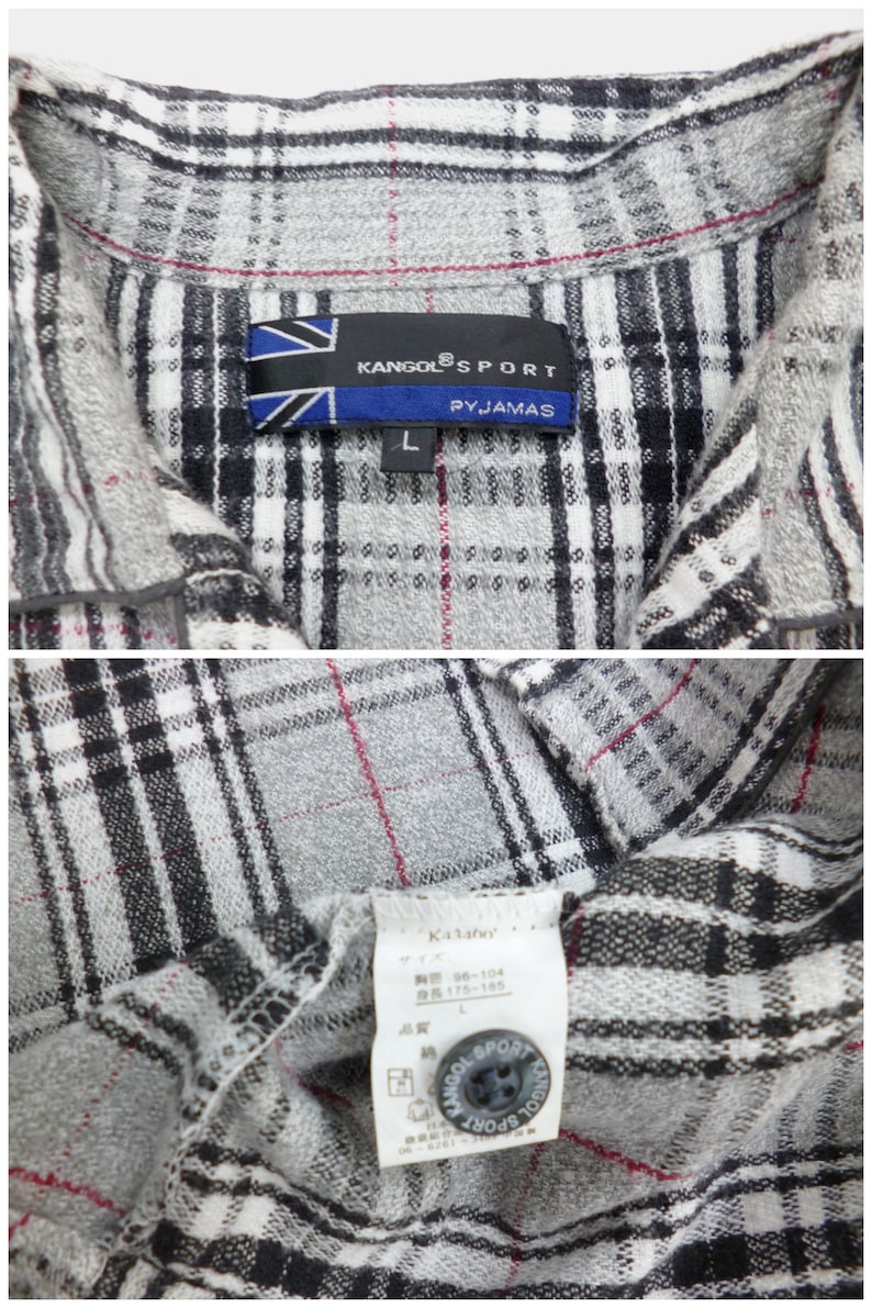 May include: Close-up of a gray, black, and white plaid pajama shirt. The shirt has a collar and a button closure. The label reads "KANGOL SPORT PYJAMAS" and "L". The shirt is made of a soft, comfortable material.