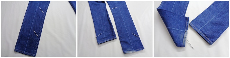 May include: Close-up shots of blue denim jeans. The jeans are laid out flat, showcasing the seams and the hem. The fabric appears to be a medium wash denim. Pins are used to hold the fabric together.