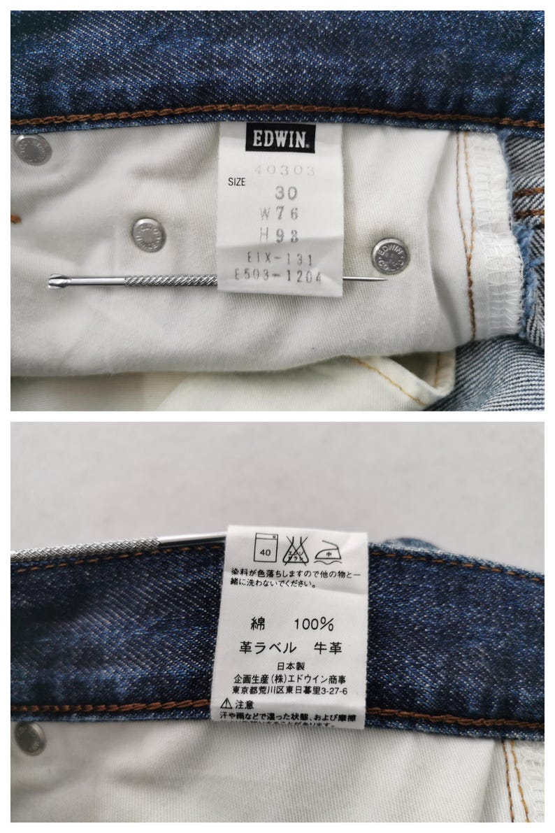 K&ouml;nnte beinhalten: Nahaufnahme der Innenseite einer blauen Jeans. Ein wei&szlig;es Etikett zeigt die Marke "EDWIN" und Gr&ouml;&szlig;enangaben: 30, W76, H93. Die Jeans hat Metallnieten und eine Metallnadel.