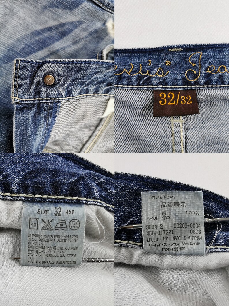 K&ouml;nnte beinhalten: Nahaufnahme einer blauen Jeans mit dem Markennamen "Levi's Jeans" in Goldfaden gestickt. Die Jeans hat ein Gr&ouml;&szlig;enetikett mit der Aufschrift "32/32" und ein Gr&ouml;&szlig;enetikett mit der Aufschrift "SIZE 32 Zoll".