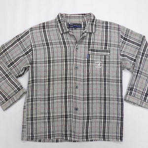 May include: A set of three ceramic mugs with a speckled, matte finish. The mugs are in shades of blue, green, and white. Each mug has a rounded handle. The mugs are stacked on top of each other.