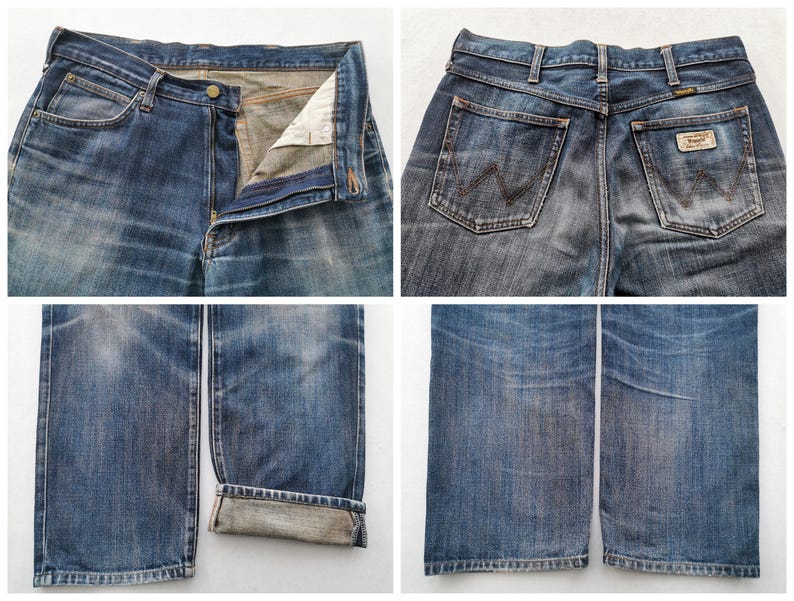 K&ouml;nnte beinhalten: Nahaufnahmen von blauen Jeans. Die Jeans sind verblichen und abgenutzt, mit sichtbaren Details der Taschen, des Knopfverschlusses und des Wrangler-Markenlabels. Der Denim hat einen klassischen, Vintage-Look.