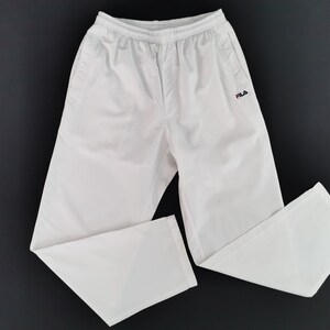 Fila white best sale track pants