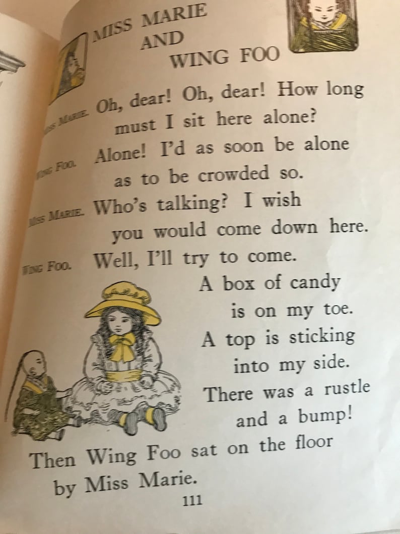 May include: A children's book illustration featuring two dolls, Miss Marie and Wing Foo. Miss Marie is wearing a yellow hat and a white dress. Wing Foo is wearing a green and brown outfit. The text reads: "Miss Marie and Wing Foo. Oh, dear! Oh, dear! How long must I sit here alone? Alone! I'd as soon be alone as to be crowded so. Who's talking? I wish you would come down here. Well, I'll try to come. A box of candy is on my toe. A top is sticking into my side. There was a rustle and a bump! Then Wing Foo sat on the floor by Miss Marie."