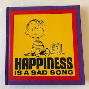 Happiness is a Sad Song, written and illustrated by Charles M. Schulz, 1967