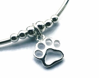 Silver paw print charm bracelet. Pet lover or pet loss gift. Dog owner gift. Mothers Day gift. Stacking bracelet and stretch jewellery