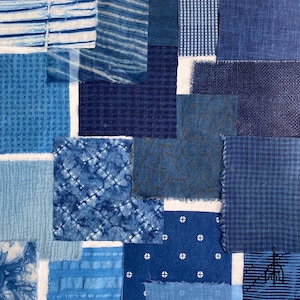 May include: A collection of blue fabric samples, showcasing diverse textures and designs. The arrangement features stripes, spots, and woven patterns in varying shades of blue. Some pieces are bordered with white, forming a collage. Measurements are not applicable.