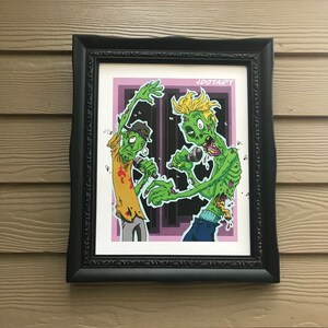 May include: Framed illustration of two cartoon zombies with green skin and exposed bones, singing into microphones. The background is a purple and black cityscape. The text "JDOTART" is in the top right corner.