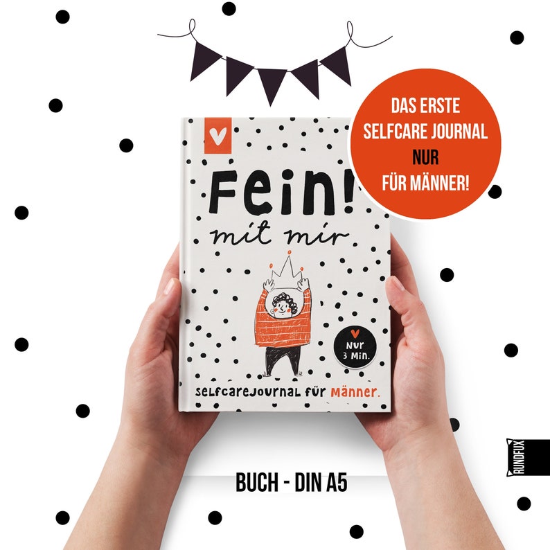 May include: A white journal with black polka dots and the text "Fein! mit mir." in red and black. The journal has a red heart with the text "Nur 3 Min." and the text "selfcareJournal f&uuml;r M&auml;nner." in black. The journal is held by two hands.