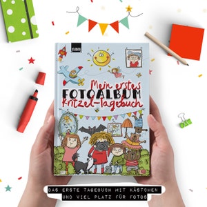 May include: A colourful book cover with the title "Mein erstes FOTOALBUM Kritzel-Tagebuch" and illustrations of children, animals, and a camera. The book is a photo album and journal for kids.