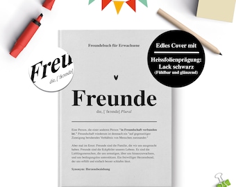 May include: A white book cover with black text that reads "Freundebuch für Erwachsene" and "Freunde" with a definition of the word "Freunde". The cover has a black and white design with a heart symbol and the text "Edles Cover mit Heissfolienprägung: Lack schwarz (Fühlbar und glänzend)".